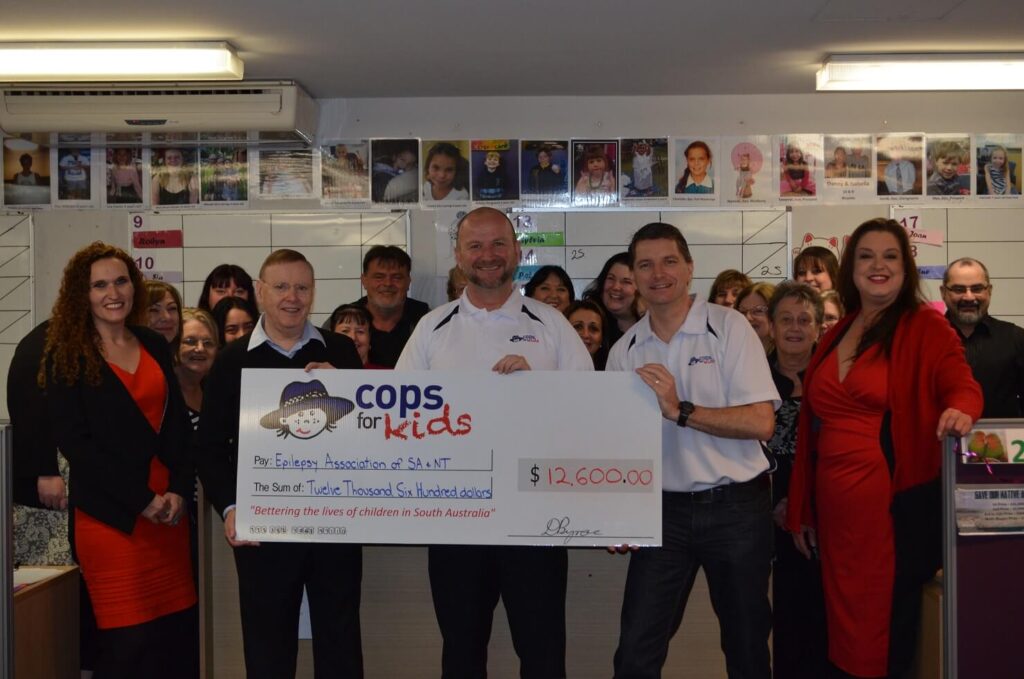 CFK Chairman Drew Bynoe and Committee Member Marty Burke presenting a cheque to the Epilepsy Centre
